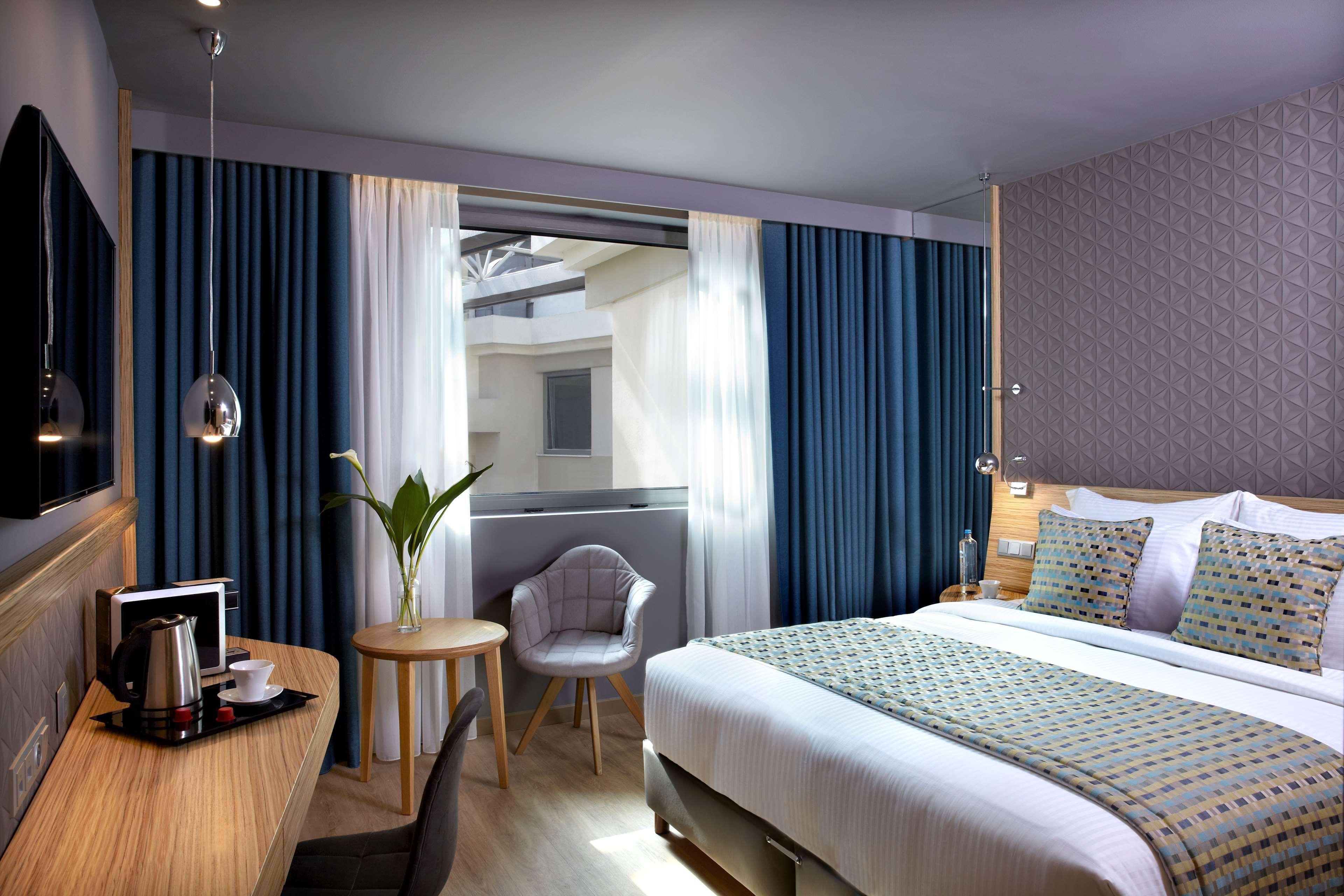 فندق ويندهام جراند أثينا المظهر الخارجي الصورة A room at the hotel